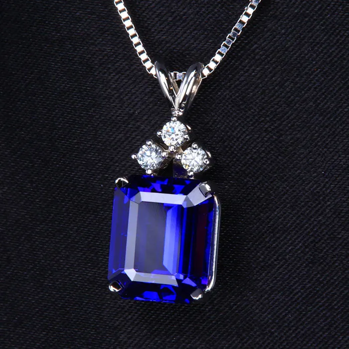 Necklaces 14K White Gold Emerald Cut Tanzanite and Three Diamond Pendant 676 Carats Moriartys Gem Art Necklaces 14K White Gold Emerald Cut Tanzanite and Three Diamond Pendant 676 Carats Moriartys Gem Art